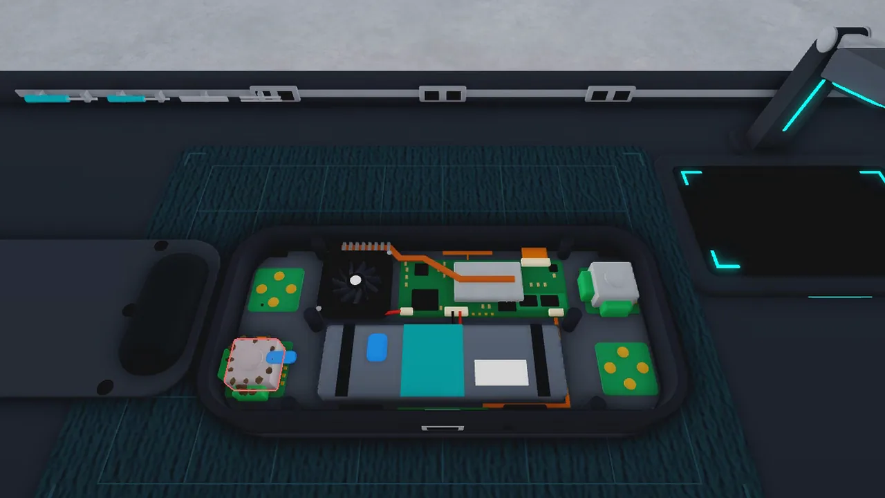 Internals of a handheld console laid out on the workbench