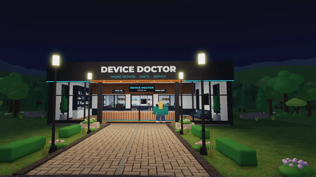 The Device Doctor storefront lit up at night
