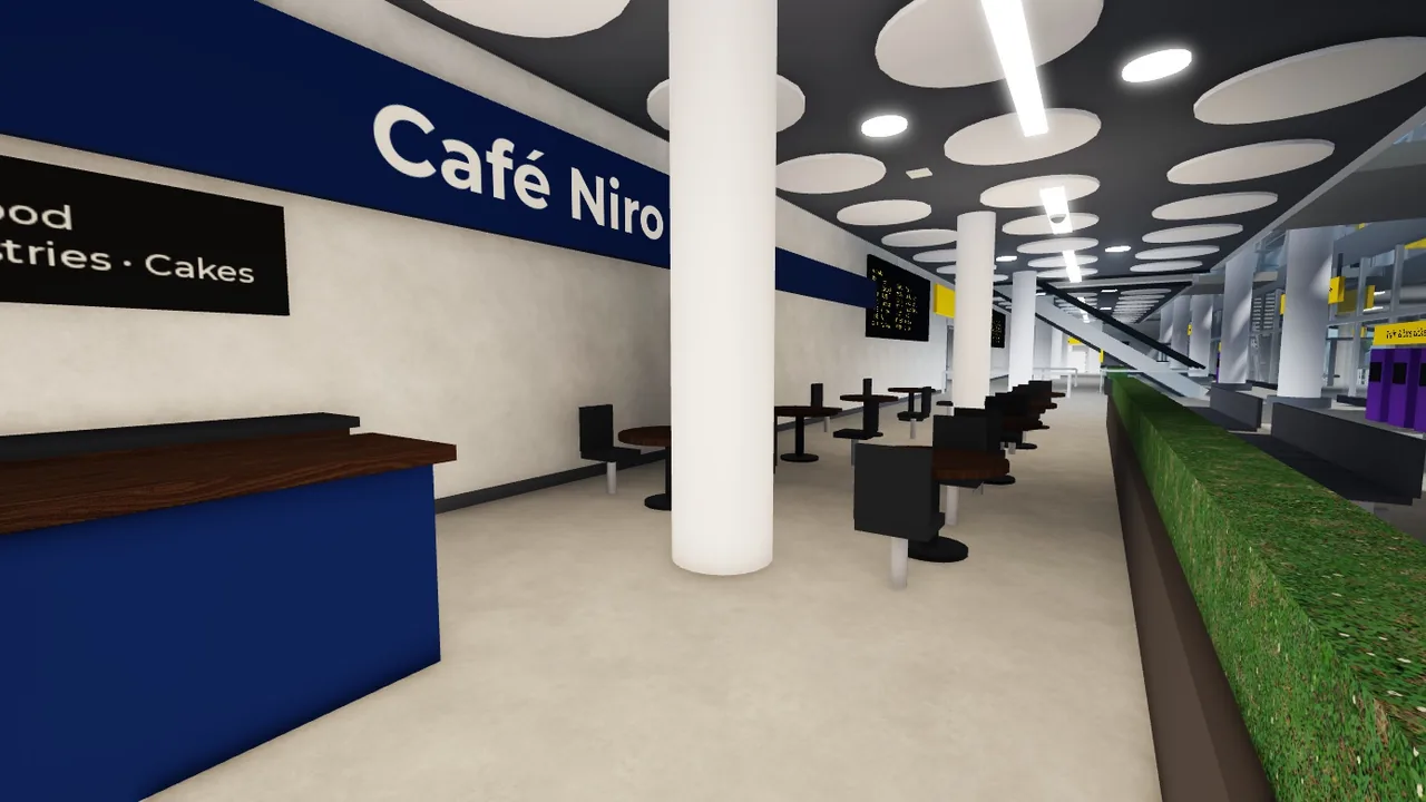 Café counter with seating inside the terminal
